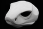 Photo showing a white, plastic 3D printed cobra snake fursuit head base complete with metal hardware at a 3/4 angle against a black background.