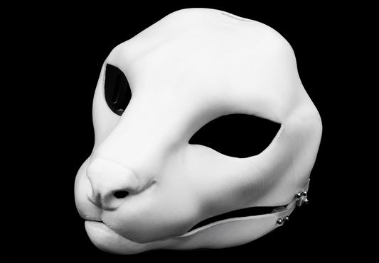 Photo showing a white, plastic 3D printed serval fursuit head base complete with metal hardware at a 3/4 angle against a black background.