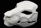 Photo showing a white, plastic 3D printed eastern dragon fursuit head base complete with metal hardware at a 3/4 angle against a black background.