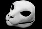 Photo showing a white, plastic 3D printed small feline fursuit head base complete with metal hardware at a 3/4 angle against a black background.