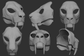 Gray 3D models of a smilodon/sabertooth cat or tiger mask or fursuit base from different angles on a dark background.